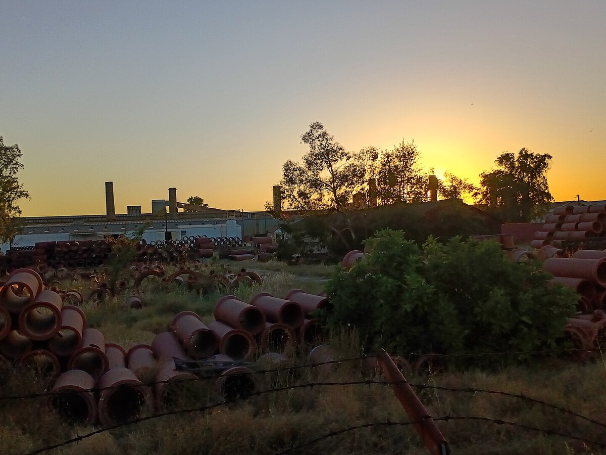 Stacks of terra cotta pipe at the Gladding, McBean works in Lincoln at sunset